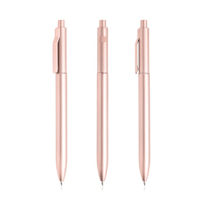 Sete canetas esferográficas metálicas cor rosa dourado alinhadas verticalmente