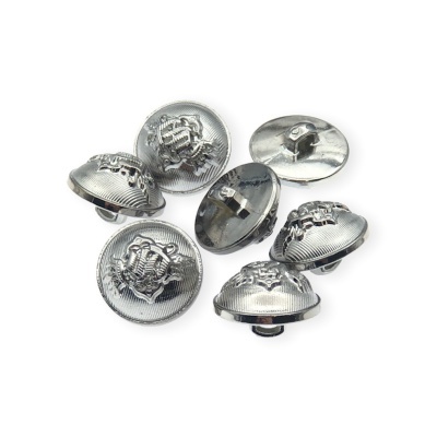 Botões metálicos prateados com relevo circular em fundo branco