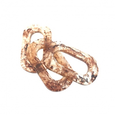 Elos interligados de plástico acrílico translúcido em tons castanhos e negros