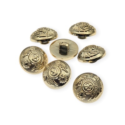 Botões dourados texturizados com símbolo central e fecho de encaixe