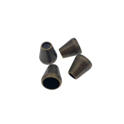 Quatro ponteiras cónicas de metal bronze escuro com interior oco