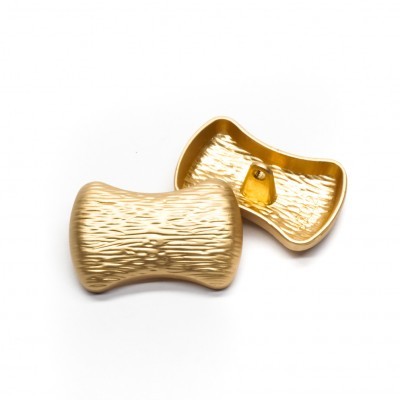 Botões dourados decorativos com textura ondulada