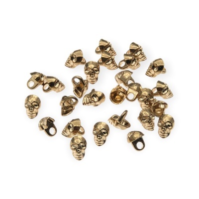 Contas metálicas douradas em forma de caveira