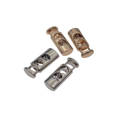 Fechos metálicos dourados e prateados com design recortado e mola interna.