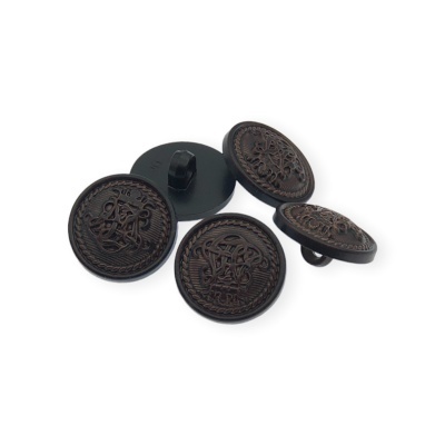 Botões de metal escuro com relevo decorativo e inscrição