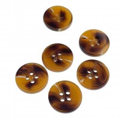 Botões de plástico castanhos marmoreados com quatro furos.