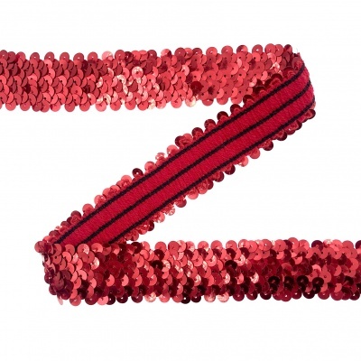 Fita decorativa vermelha com lantejoulas e faixa central listrada