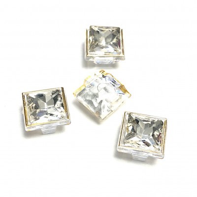 Botões quadrados transparentes com bordas douradas e textura facetada