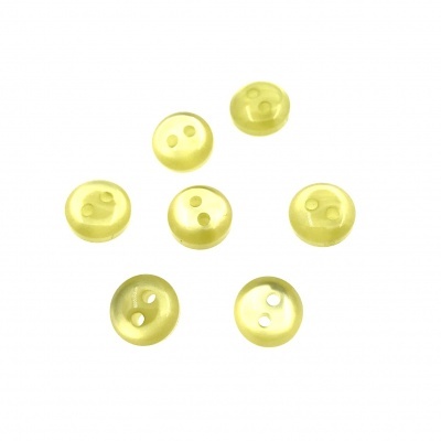 Sete botões redondos amarelos translúcidos com dois orifícios