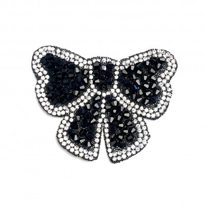 Broche em forma de laço com cristais pretos e transparentes