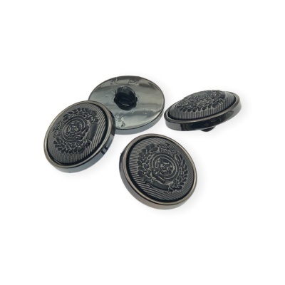 Quatro botões pretos redondos com padrão relevo circular