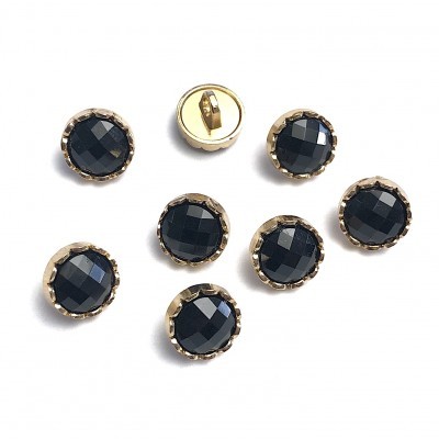 Oito botões dourados com topo preto facetado