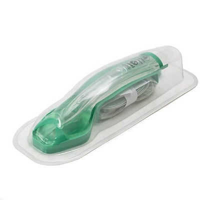 Aparelho verde translúcido em embalagem de plástico transparente