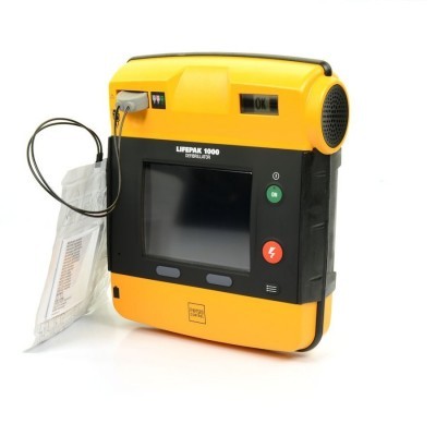 Desfibrilhador LIFEPAK 1000 amarelo e preto com ecrã digital e botões