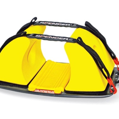 Dispositivo amarelo e preto com alças, base preta e fechos metálicos