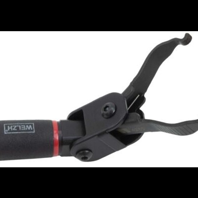 Aparelho preto com punho vermelho e texto WELSH