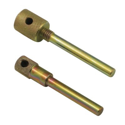 Duas peças metálicas cilíndricas douradas com secção texturizada e orifício