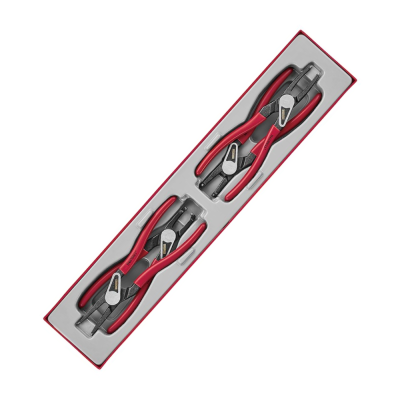 Conjunto de alicates com punhos vermelhos e negros em caixa retangular.