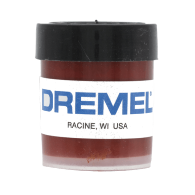 Pequeno frasco plástico castanho com tampa preta e etiqueta DREMEL