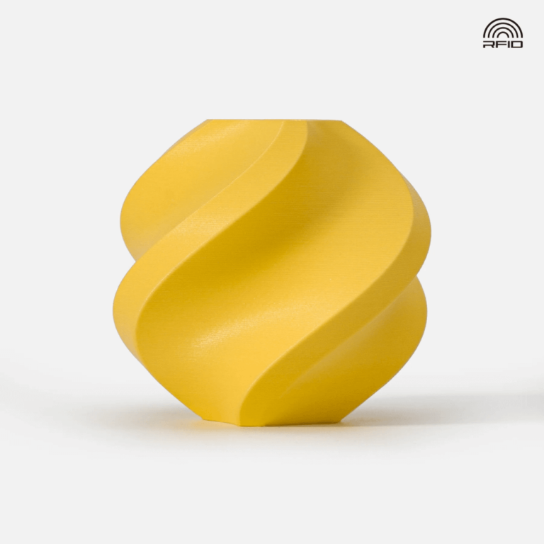 Objeto decorativo amarelo em espiral com fundo branco