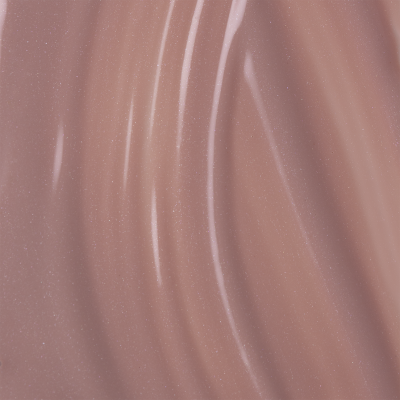 Superfície rosa com textura brilhante e partículas finas