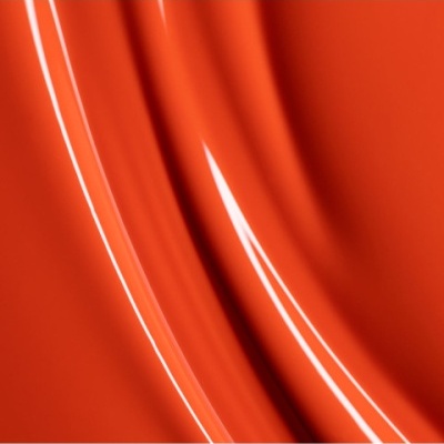 Superfície lisa e brilhante laranja com reflexos de luz