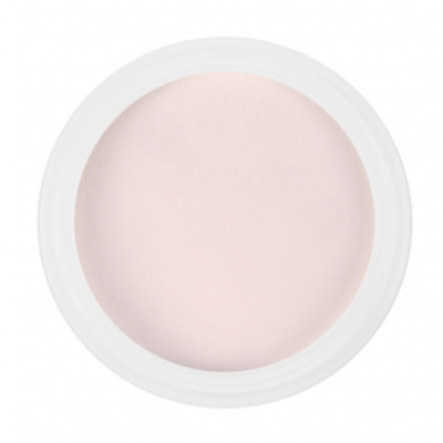 Base cremosa cor de pele clara em recipiente branco visto de cima