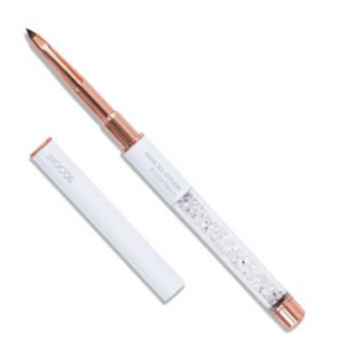 Caneta esferográfica com corpo transparente e pedras brilhantes