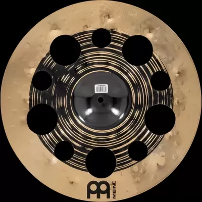 Prato musical Meinl dourado e preto com furos circulares e textura martelada