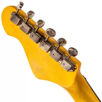 Cabeça de guitarra elétrica amarela com cravelhas metálicas envelhecidas