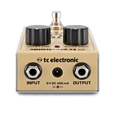 Pedal de efeitos TC Electronic dourado com botões pretos e conexões de entrada e saída