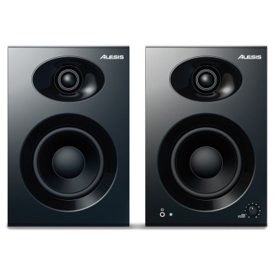 Par de colunas de som Alesis pretas com altifalantes circulares.