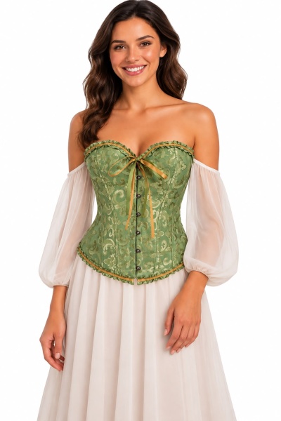 Corset verde decorativo com padrão floral usado sobre vestido branco com mangas largas.