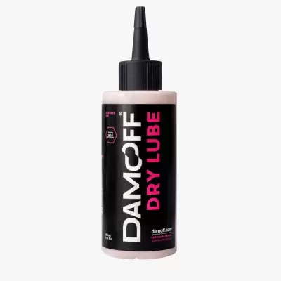Frasco de lubrificante Damcoff Dry Lube com etiqueta preta e rosa