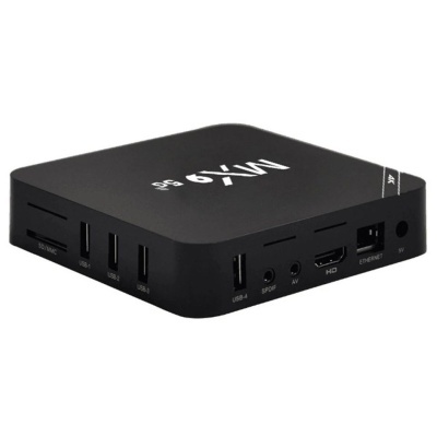 Caixa preta TV Box com múltiplas portas e logotipo branco mx9 g4