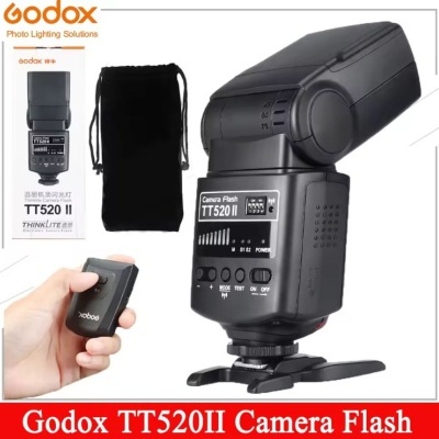 Flash de câmera Godox TT520II preto com acessórios e embalagem
