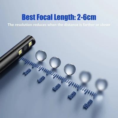 Objeto preto com luzes LED e gotas de água sobre régua mostrando distâncias de 2 a 10 cm