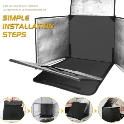 Tenda de fotografia preta com interior prateado reflexivo e fechos de velcro, exibida em processo de montagem.