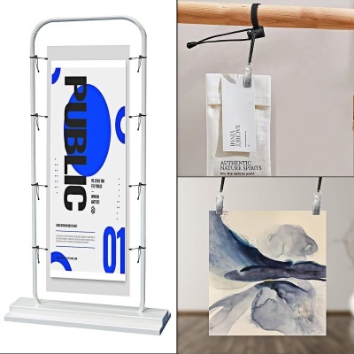 Três suportes para exibir cartazes com cartazes de cores claras e texto visível em português e inglês