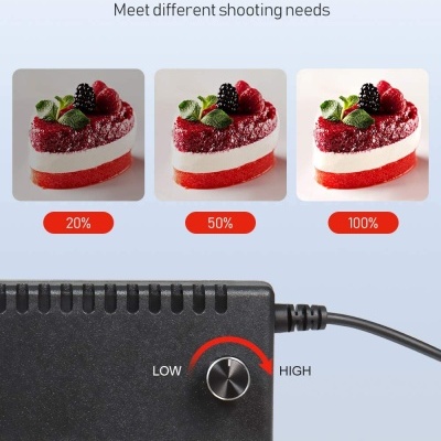 Controlador de dimmer preto com botão e três fotos de bolo em diferentes níveis de luz.