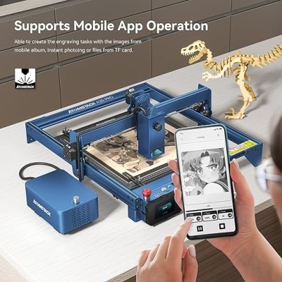 Máquina de gravação azul Azonstack KD20 Pro em mesa com telemóvel e miniatura de dinossauro