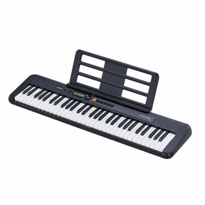 Teclado musical electrónico preto com suporte para partituras