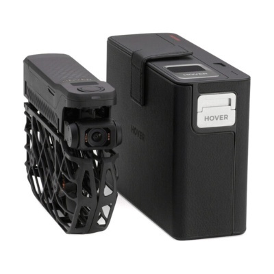 Câmara de vídeo drone preta com estrutura de grelha e caixa preta com etiqueta HOVER