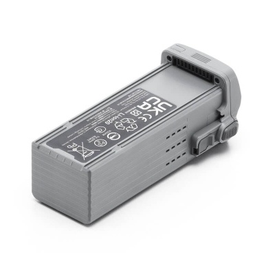 Bateria cinzenta de drone com texto branco e conector visível