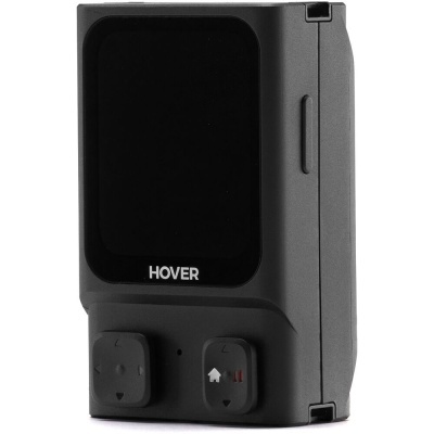 Unidade eletrónica preta com ecrã negro e botões quadrados em fundo branco