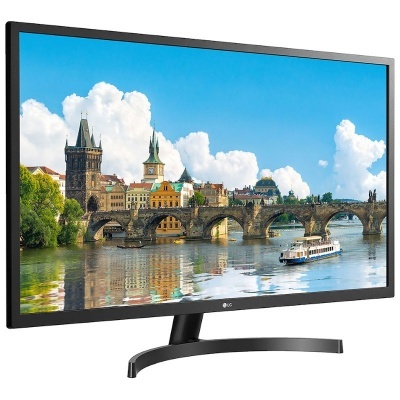 Monitor LG preto com base curva a mostrar paisagem urbana