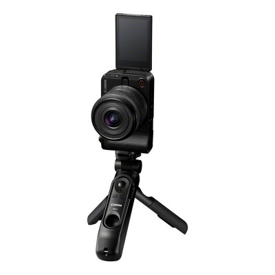 Câmara digital Canon preta montada num tripé com ecrã LCD virado para cima