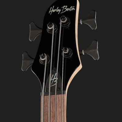 Cabeça de guitarra elétrica preta e madeira com cravelhas e inscrições