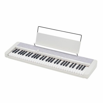 Teclado musical eletrónico branco com suporte para partituras