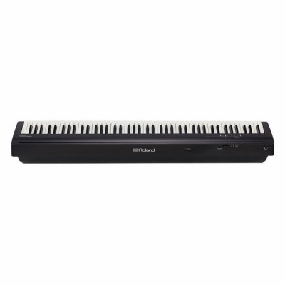 Teclado piano digital preto Roland com teclas brancas e pretas